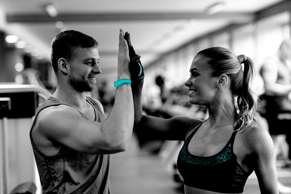 Two personal trainers celebrating success